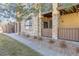 Multi-Gathering unit featuring stone accents, private balcony, and walkway. The landscape adds to the curb appeal at 9896 W Freiburg Dr # 1B, Littleton, CO 80127