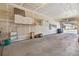 Spacious garage featuring storage cabinets and overhead lighting at 9896 W Freiburg Dr # 1B, Littleton, CO 80127