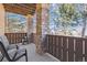 Charming outdoor patio space featuring natural stone columns, and comfortable seating at 9896 W Freiburg Dr # 1B, Littleton, CO 80127