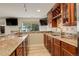 Granite countertop bar featuring a sink and a window view at 23427 Song Bird Hills Pl, Parker, CO 80138