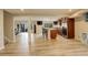 Open basement floorplan with bar area and adjacent living room area at 23427 Song Bird Hills Pl, Parker, CO 80138