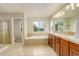 Bright bathroom with a separate shower, large tub under window, and a double sink vanity at 23427 Song Bird Hills Pl, Parker, CO 80138