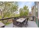 Deck with table and chairs overlooking a golf course at 23427 Song Bird Hills Pl, Parker, CO 80138