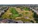 View of the sprawling golf course with meticulously manicured greens at 23427 Song Bird Hills Pl, Parker, CO 80138