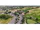 View of the meticulously landscaped golf course and community clubhouse at 23427 Song Bird Hills Pl, Parker, CO 80138