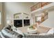 Inviting living room with fireplace, second-story view, and open access to other rooms at 23427 Song Bird Hills Pl, Parker, CO 80138