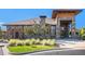 Stone clubhouse with manicured lawn and elegant architectural details at 14284 W 88Th Dr # B, Arvada, CO 80005