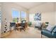 Office space with two large windows offering views of nature, and comfortable seating space at 14284 W 88Th Dr # B, Arvada, CO 80005