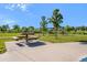 Scenic picnic area with benches, lush greenery, and paved walkways at 14284 W 88Th Dr # B, Arvada, CO 80005