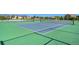 Well-maintained community tennis courts with green and blue playing surfaces at 14284 W 88Th Dr # B, Arvada, CO 80005