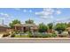 Charming home exterior featuring well-manicured landscaping, a covered porch, and tasteful fencing at 2196 W 56Th Ave, Denver, CO 80221