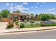 Charming home featuring a welcoming front porch and beautifully landscaped front yard with vibrant flowers at 2196 W 56Th Ave, Denver, CO 80221