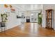 Hardwood floors highlight this open concept room flowing into the kitchen and out to the backyard at 2196 W 56Th Ave, Denver, CO 80221