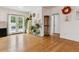 Bright living room with hardwood floors and french doors leading to outdoor area at 2196 W 56Th Ave, Denver, CO 80221