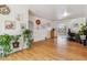 Bright living room with hardwood floors and lots of natural light from the doorway to the backyard at 2196 W 56Th Ave, Denver, CO 80221