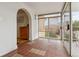Bright sunroom featuring tile flooring and access to the outdoor deck at 2196 W 56Th Ave, Denver, CO 80221