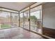 Sunroom with tiled floors, glass doors, screens, and outdoor seating area at 2196 W 56Th Ave, Denver, CO 80221