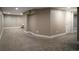 Finished basement with neutral carpeting, ready to be transformed into a living or recreational space at 285 E Dartmouth Ave, Englewood, CO 80113