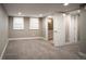 Bedroom with carpet, bright windows, and access to a bathroom and additional closet space at 285 E Dartmouth Ave, Englewood, CO 80113