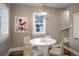 Comfortable dining area featuring a contemporary chandelier and seating for four at 285 E Dartmouth Ave, Englewood, CO 80113