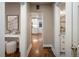 Hallway featuring white trim and hardwood floors at 285 E Dartmouth Ave, Englewood, CO 80113