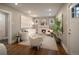 Bright living room featuring a fireplace, stylish decor, modern furniture, neutral paint, and hardwood floors at 285 E Dartmouth Ave, Englewood, CO 80113