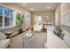 Stylish living room with hardwood floors, neutral paint, modern décor, and a view into the kitchen at 285 E Dartmouth Ave, Englewood, CO 80113