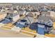 Aerial view of home featuring a three-car garage in a new community at 7414 E 158Th Pl, Thornton, CO 80602