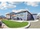 Spacious backyard with patio, outdoor kitchen, pergola, and artificial grass at 7414 E 158Th Pl, Thornton, CO 80602