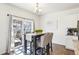 Cozy dining area featuring a table with seating for four and sliding glass doors to outdoor patio at 7414 E 158Th Pl, Thornton, CO 80602