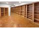Basement space with extensive built-in shelving, offering ample storage or display options at 584 W Prestwick Way, Castle Rock, CO 80104