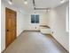 Finished basement area with door, window and built in bench seat at 584 W Prestwick Way, Castle Rock, CO 80104