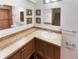 Bright bathroom with an extended countertop, decorative mirrors, and modern sink fixtures at 584 W Prestwick Way, Castle Rock, CO 80104