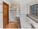 Beautiful bathroom showcasing a glass shower, soaking tub, and decorative stone details at 584 W Prestwick Way, Castle Rock, CO 80104