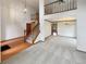 Elegant entryway featuring a staircase, hardwood floors, and an open view to the living spaces at 584 W Prestwick Way, Castle Rock, CO 80104