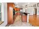 Modern kitchen with granite countertops, stainless steel appliances, and wood cabinets at 584 W Prestwick Way, Castle Rock, CO 80104