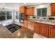 Well-equipped kitchen boasts granite countertops, stainless steel appliances, and warm wood cabinetry at 584 W Prestwick Way, Castle Rock, CO 80104