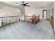 Open loft area with railing overlooking the entry and steps to the next level at 584 W Prestwick Way, Castle Rock, CO 80104