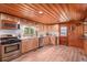 Well-appointed kitchen featuring stainless steel appliances, light wood cabinets, and tile backsplash at 11080 S Deer Creek Rd, Littleton, CO 80127