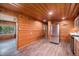 Spacious kitchen layout with wood paneling and stainless steel appliances at 11080 S Deer Creek Rd, Littleton, CO 80127