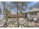 Backyard view with stone patio and wooden privacy fence at 3064 S Cherokee St, Englewood, CO 80110