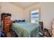 Comfortable bedroom with a window allowing natural light and ample space at 3064 S Cherokee St, Englewood, CO 80110