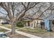 Quaint home featuring a fenced yard, and mature trees at 3064 S Cherokee St, Englewood, CO 80110