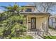 Charming home with a cozy front porch and well-maintained yard with mature landscaping at 3064 S Cherokee St, Englewood, CO 80110