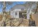Garage exterior with white siding, an open door and stone walkway at 3064 S Cherokee St, Englewood, CO 80110