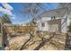 Garage exterior with stone patio and wooden privacy fence at 3064 S Cherokee St, Englewood, CO 80110