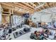 Large garage with exposed wood beams and unfinished drywall at 3064 S Cherokee St, Englewood, CO 80110