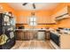 Functional kitchen with ample cabinet space, standard appliances, and laminate countertops at 3064 S Cherokee St, Englewood, CO 80110