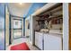 Laundry room with blue trim and washer and dryer hookups at 3064 S Cherokee St, Englewood, CO 80110