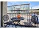 A cozy balcony features seating for two at 830 N Sherman St # 205, Denver, CO 80203